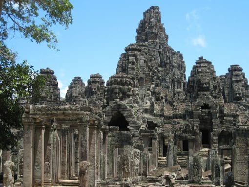 Ancient temple ruins at Angkor Wat, showcasing intricate stone architecture and historical significa.
