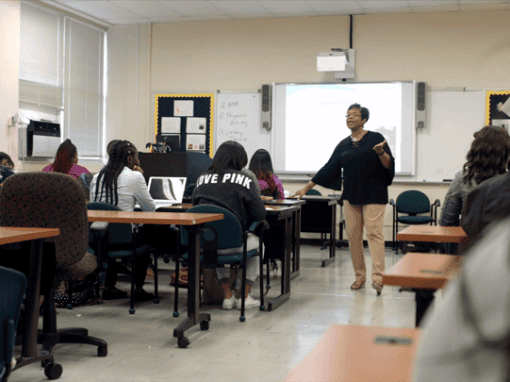 Teacher conducting a lesson in a classroom setting at CAES News.