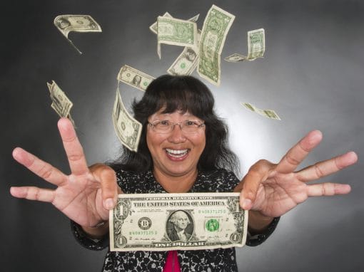Money raining over happy woman with dollar bills flying around.