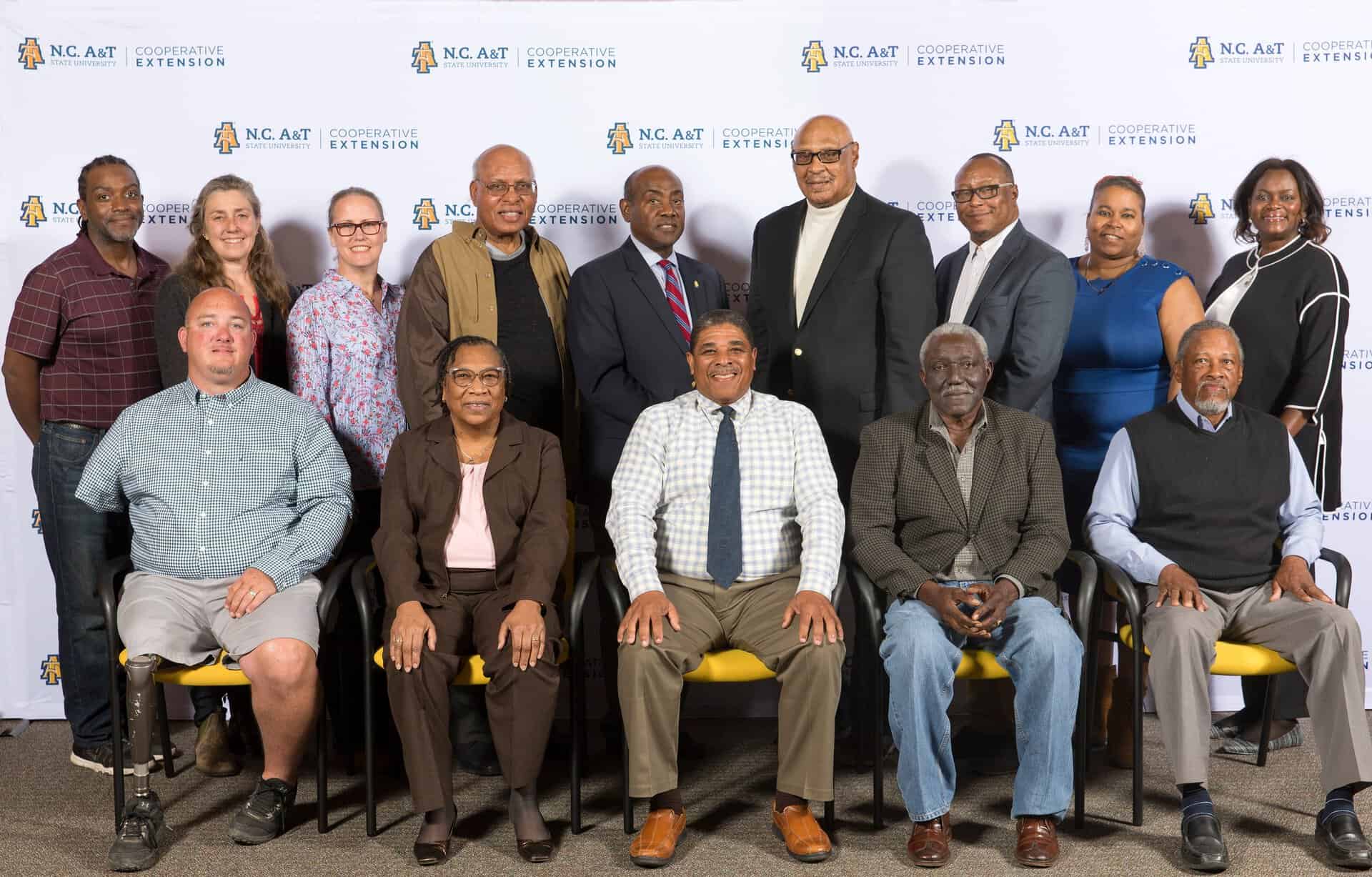 Group of diverse professionals at NC A&T Cooperative Extension event.