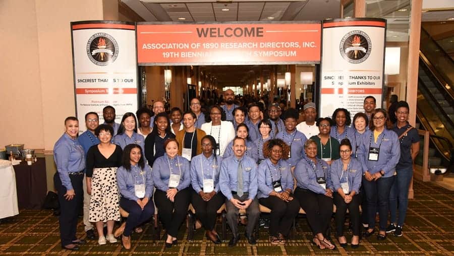 Empowered research professionals at CAES News 19th Biennial Symposium group photo.