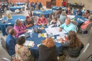 Diverse group of professionals in a conference room during a meeting.