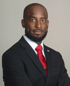 African American businessman in formal attire with confident expression.