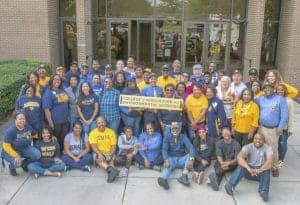 Diverse group of students and faculty at College of Agriculture & Environmental Sciences.