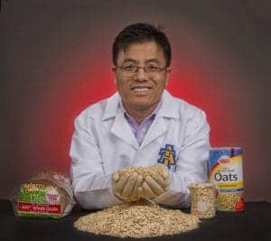 Organic whole grain oats with a scientist demonstrating the health benefits and nutritional value of.
