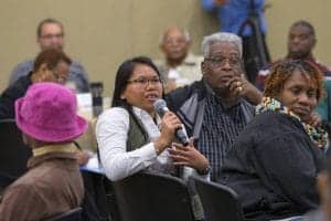 Engaged diverse group of people participating in a community discussion or workshop.