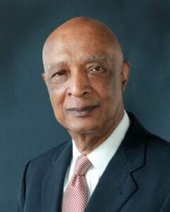 Empowered senior African American man in formal suit and tie, professional portrait for news or busi.