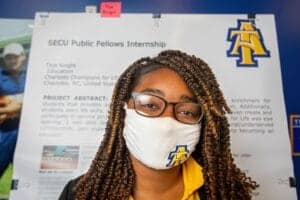SECU Public Fellows Internship program at CAES News, featuring a woman wearing a face mask with univ.