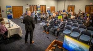 Business conference with audience and speaker in a modern meeting room.