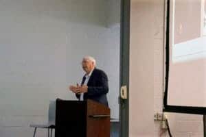 Speaker giving a presentation at a professional conference.