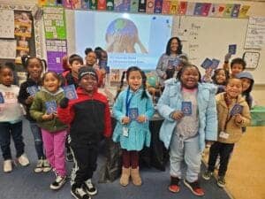 Exploring the world: diverse elementary students with passports in classroom celebrating global trav.