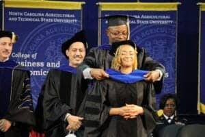 Graduation ceremony at North Carolina A&T State University with graduates in academic regalia.