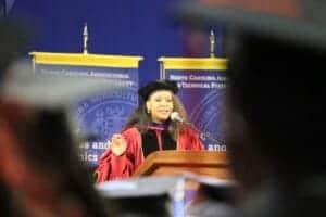 North Carolina Agricultural University graduation ceremony with speaker at podium.