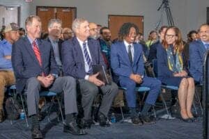Diverse group of professionals attending a conference or seminar.