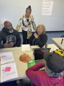 High school students collaborating in a classroom for educational news coverage.