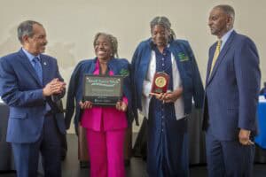 Celebration of Small Farms Week with award ceremony and smiling participants.