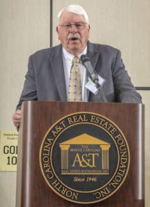 Experienced speaker at North Carolina A&T Real Estate Foundation event delivering a presentation on.