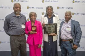 Celebrating agricultural achievements at NC A&T Cooperative Extension event in North Carolina.