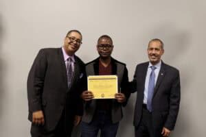 Celebrating academic achievement with diverse professionals at a formal event.