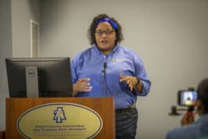 A woman speaking at a podium during a presentation at North Carolina Agricultural and Technical Stat.