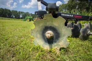 High-precision agricultural equipment on lush green field for sustainable farming practices.