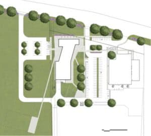 Campus layout showing buildings, parking lots, and landscaped areas with trees.