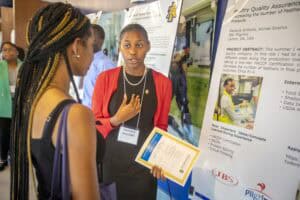 Engaging student presenting research at academic conference.