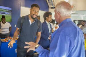 Engaging conversation at a professional networking event or conference.