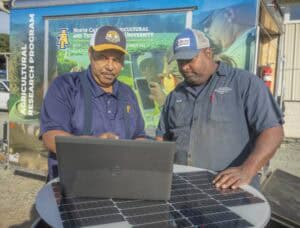Innovative agricultural research at North Carolina A&T State University with two experts examining d.