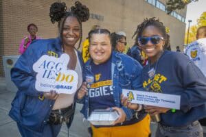 Bright smiling students at North Carolina Agricultural and Technical State University event promotin.