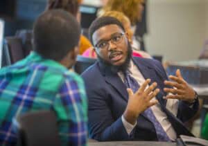 Engaged professional man speaking during a business meeting or conference.