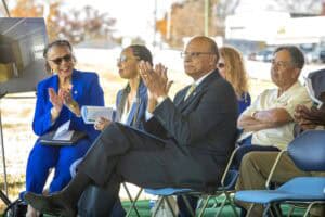 Innovative business meeting outdoors with diverse professionals discussing strategies.