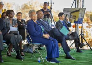 Empowered diverse professionals attending outdoor conference or seminar event.