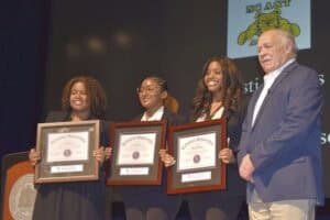 Students receiving awards at CAES News honors event.