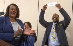 Celebrating success at CAES News with happy team members.