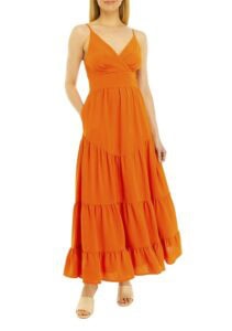 Bright orange maxi dress with spaghetti straps and ruffled hem, perfect for summer or casual occasio.