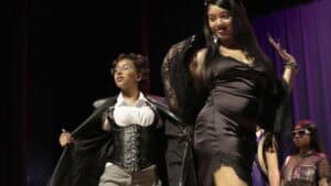 Empowered women celebrating success at a graduation ceremony on stage.