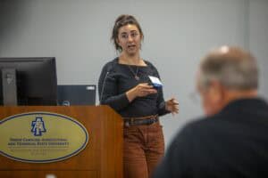 A woman giving a presentation at North Carolina Agricultural and Technical State University.