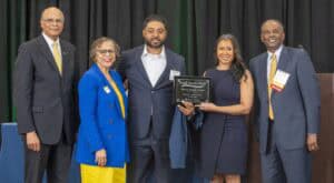 CAES News Award Ceremony with Diverse Professionals and Honorees.