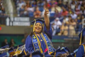 Graduation cap and gown celebration at a university commencement ceremony.
