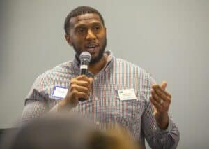 Empowered speaker at conference sharing insights on community development and leadership.