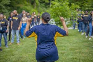 Empowering outdoor training session with diverse group of people in a lush green park.