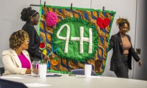 Empowering women at a 4-H event with vibrant African-inspired decorations and community engagement.