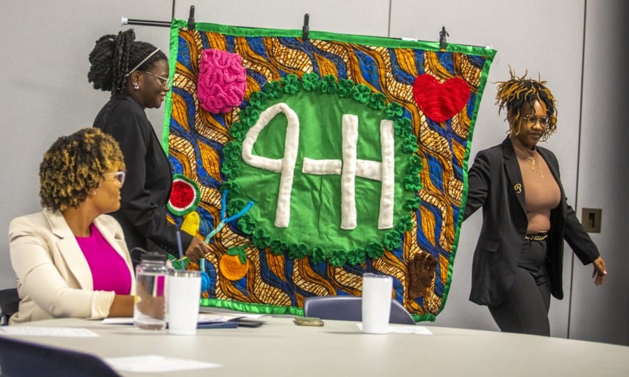 Empowering women at a 4-H event with vibrant African-inspired decorations and community engagement.