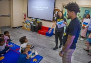 Engaging young students at a Black Scholar Workshop in a classroom setting.