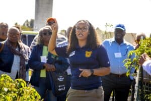 Empowering community leaders at CAES News outdoor event for agricultural development.