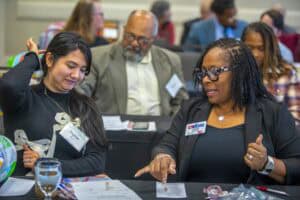 Engaging professional discussion at a conference or workshop.