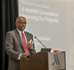Keynote speaker at CAES News conference on program improvement at Marriott hotel.