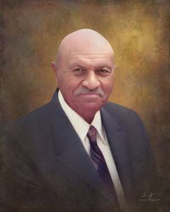 A formal portrait of an older man with a bald head and a gray mustache. He is wearing a dark suit, white shirt, and a tie, and is shown against a soft, warm-toned background. The man has a calm and confident expression.