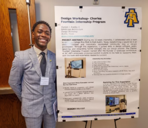 A smiling man in a gray suit stands next to a display board titled Design Workshop- Charles Fountain Internship Program detailing his landscape architecture project and internship experience.